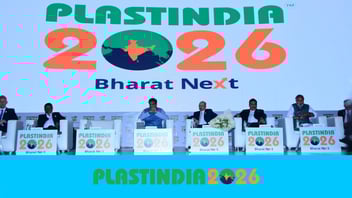 PlastIndia 2026 event stage with branding and slogan Bharat Next in New Delhi