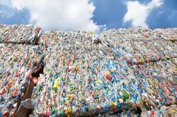 Polystyrene materials moving through recycling and manufacturing processes, illustrating the growing role of recycled content in future plastics supply chains.