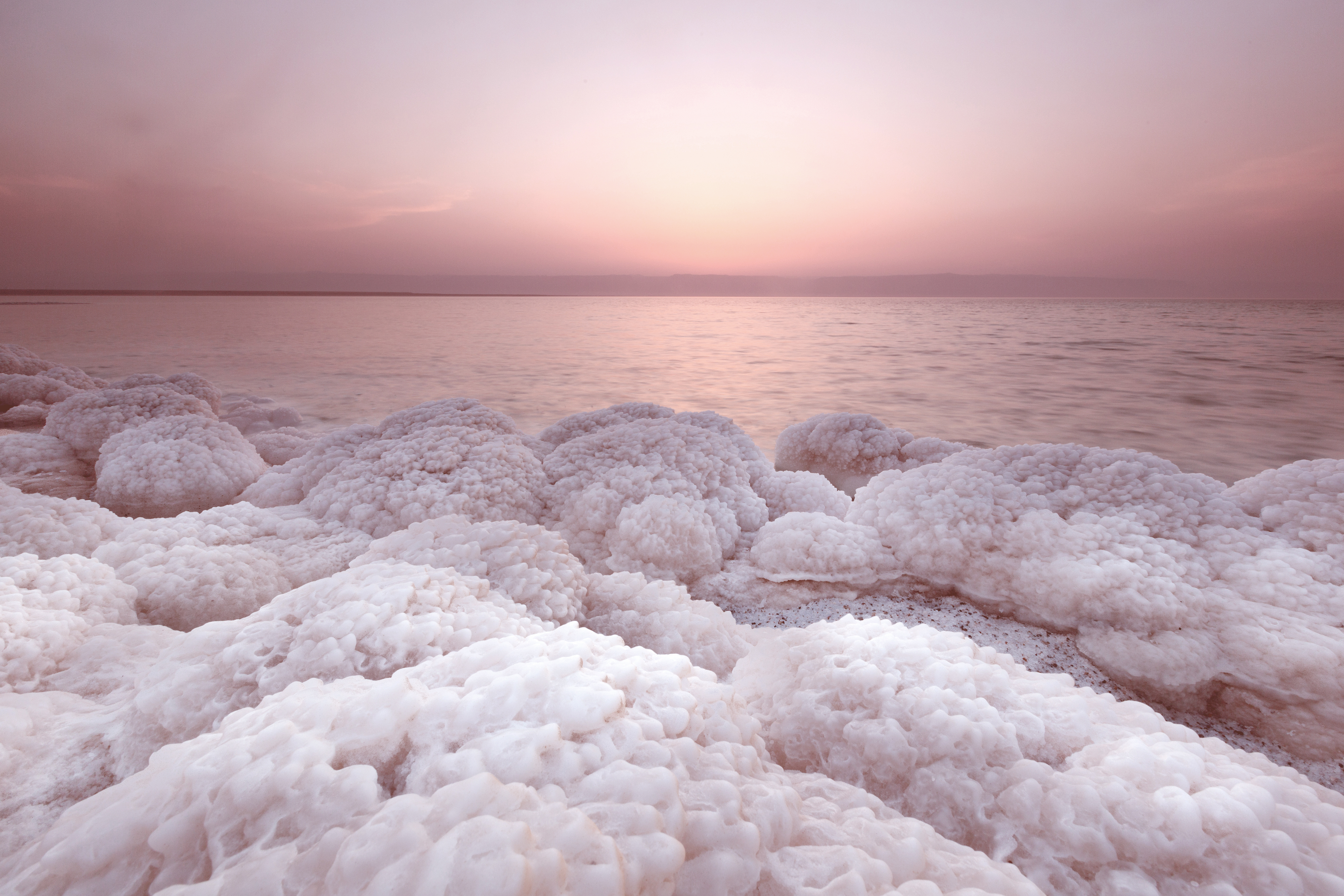 Salt lake brine deposits used for lithium extraction, illustrating natural salt formations at sunrise and the resource potential for sustainable hydrometallurgy.