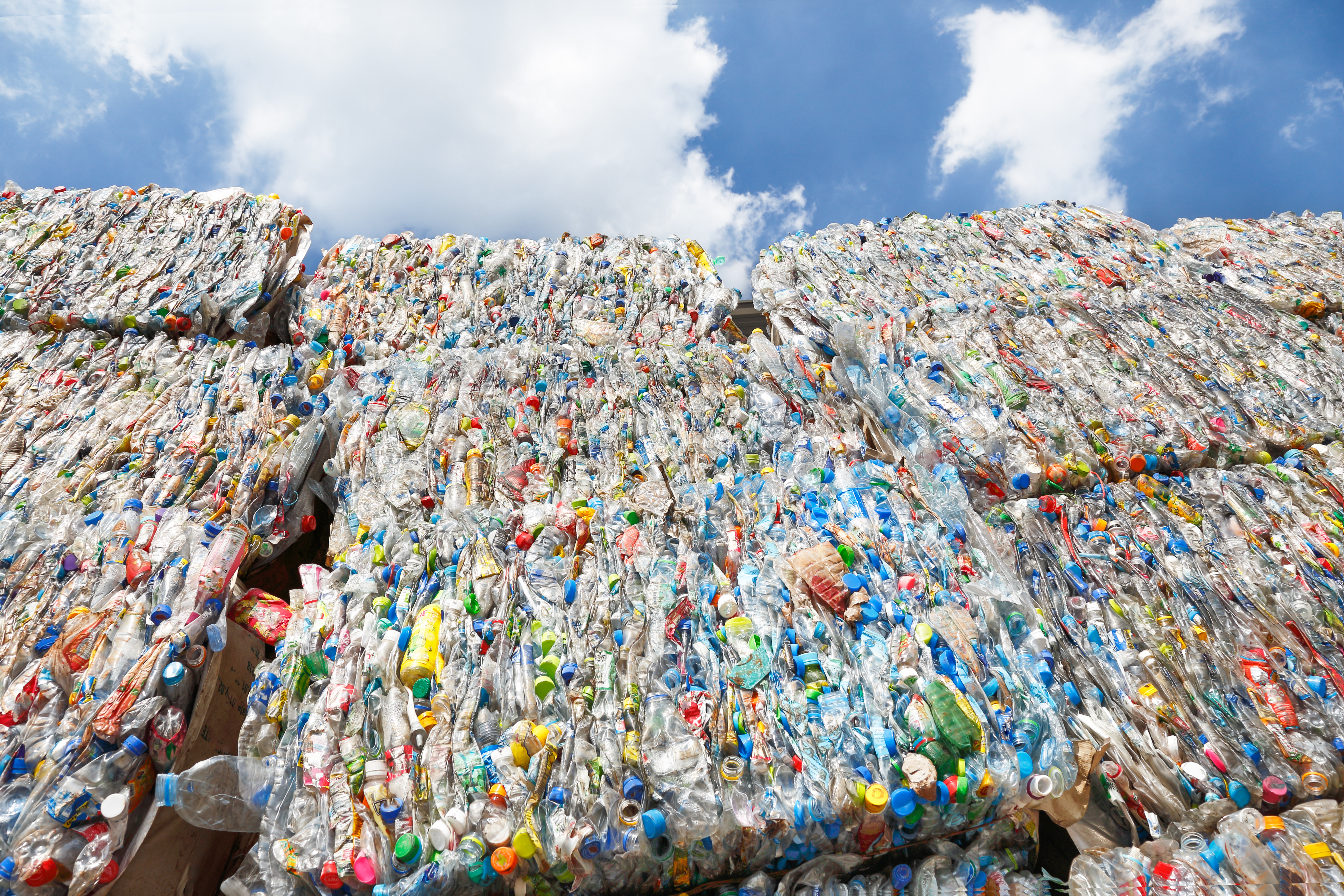 Polystyrene materials moving through recycling and manufacturing processes, illustrating the growing role of recycled content in future plastics supply chains.